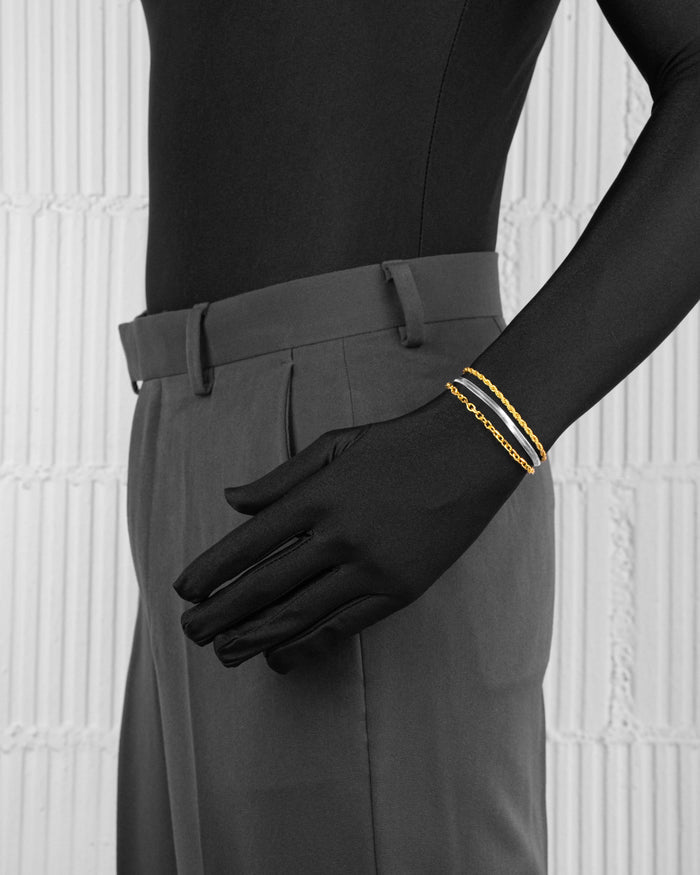 man with black suit wearing yellow and white gold coated 3 layers bracelet with 3mm rope and cable chain and contrasting 4mm herringbone chain