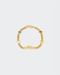 A Vibe cuban chain bracelet with 18kt yellow gold coating, mixed shape bezel stones in diamond white, yellow, garnet, tanzanite and "A Vibe" central metal tag. Lobster clasp with logo