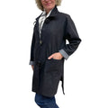 Person wearing a dark gray coat on a white background