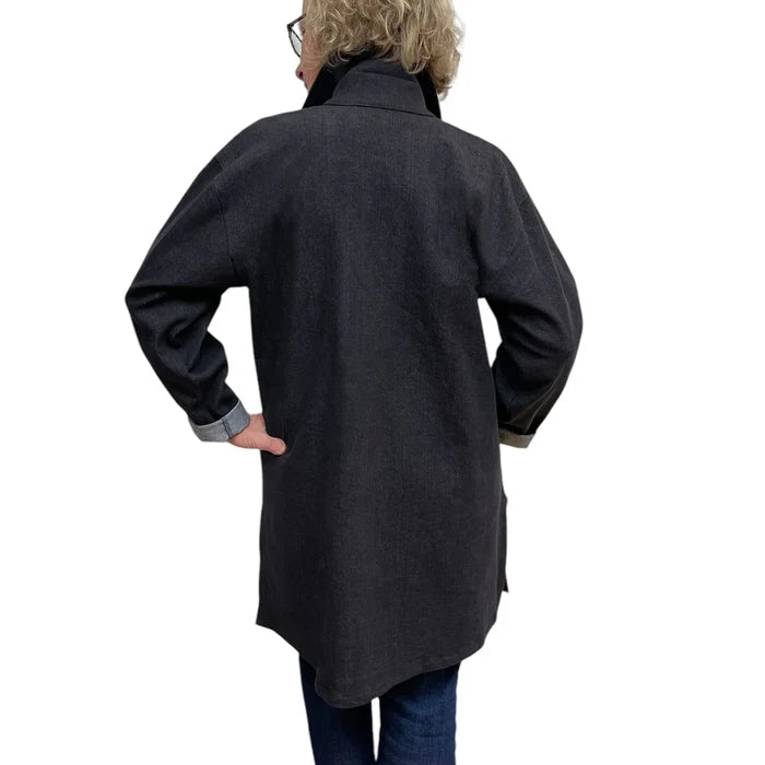Person wearing a dark gray coat on a white background