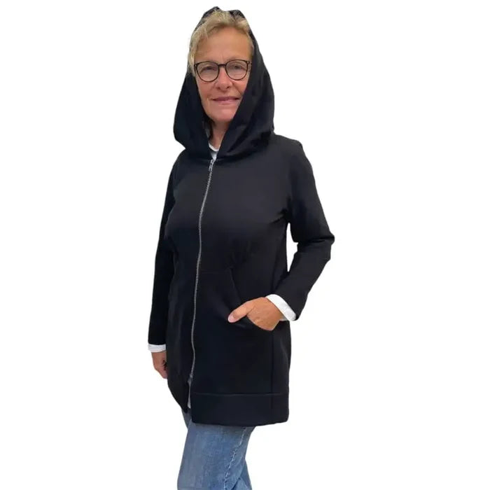 Person wearing a black hoodie on a white background