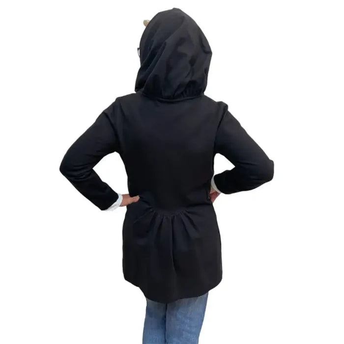 Person wearing a black hooded jacket on a white background
