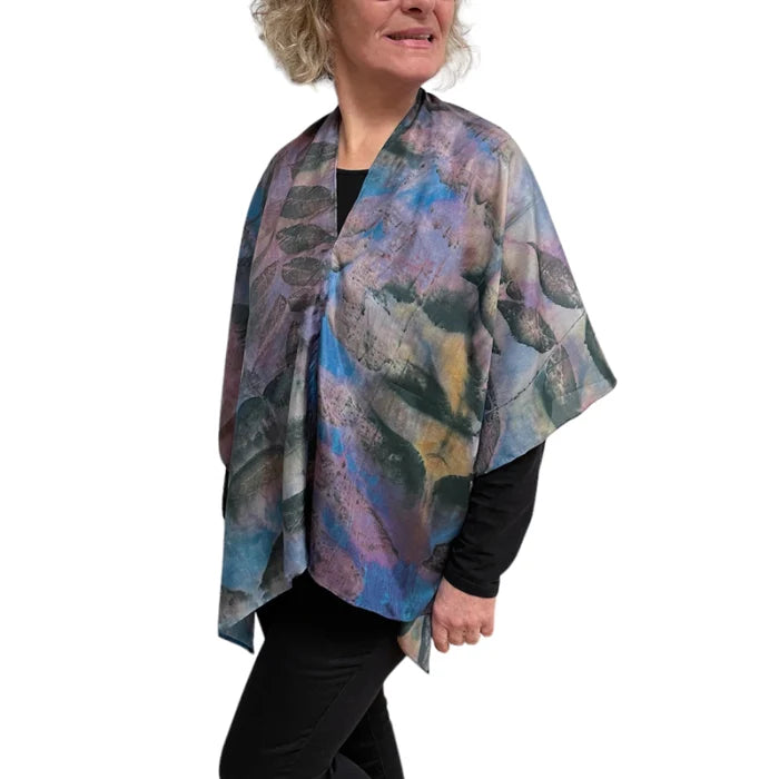 Woman wearing a colorful scarf with a white background