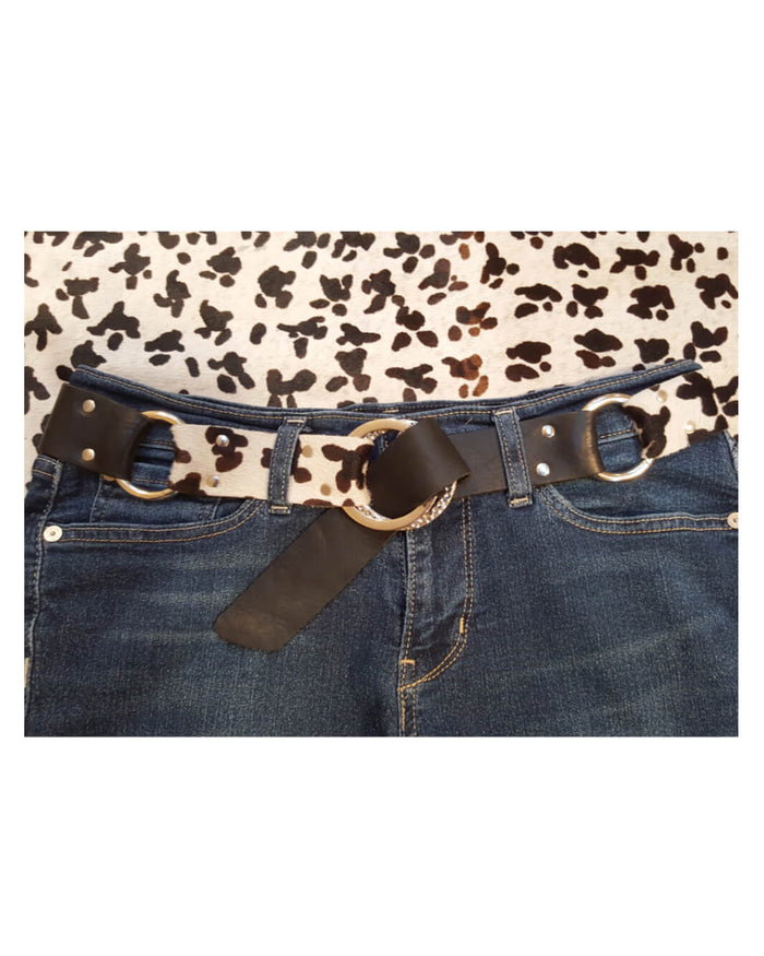 Leopard print shirt with a black belt and blue jeans on a white background