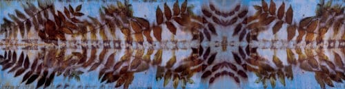 Patterned fabric with brown and white design on a blue background