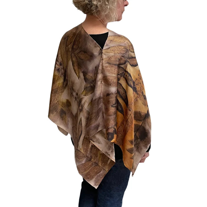 Person wearing a brown and beige patterned scarf on a white background