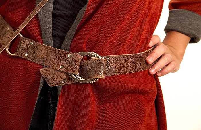 Person wearing a red garment with a brown belt and silver buckle.