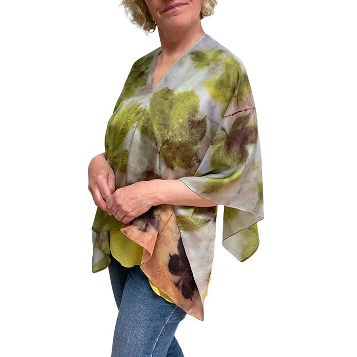 Woman wearing a floral patterned scarf on a white background