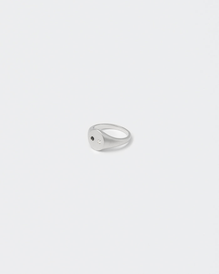 white gold satined ring with hand-set stones in white and black for man and women