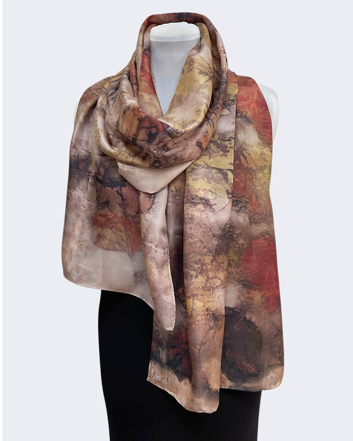 Multicolored Copper Rust Silk Scarf Tulip Tree Eco Print against a white background