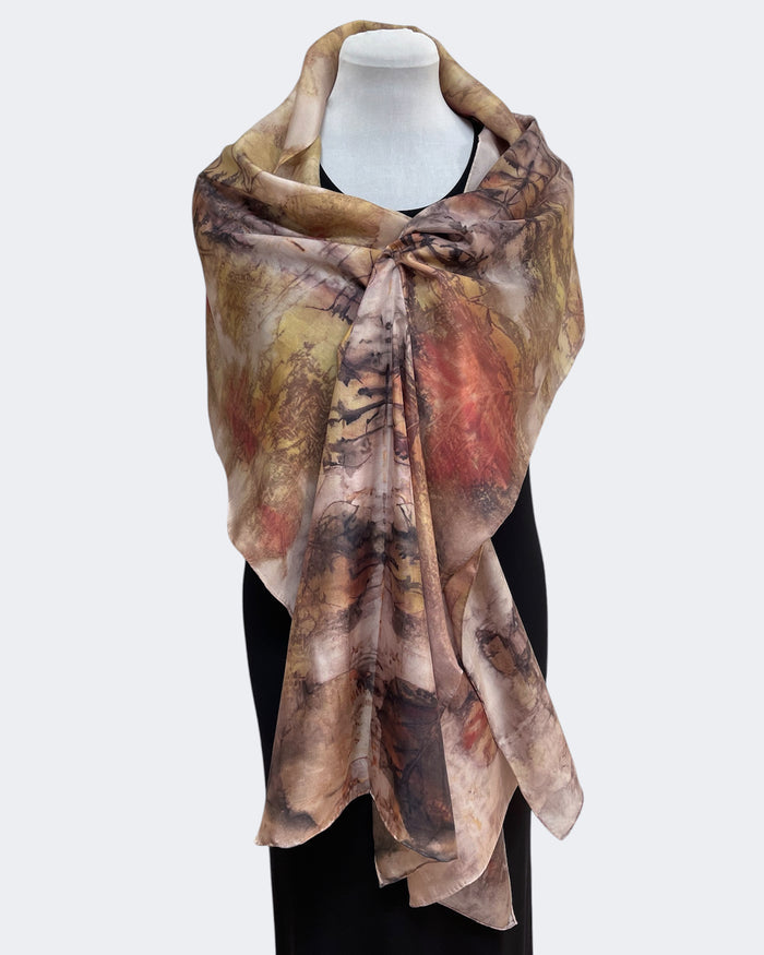 Multicolored scarf on a mannequin against a white background