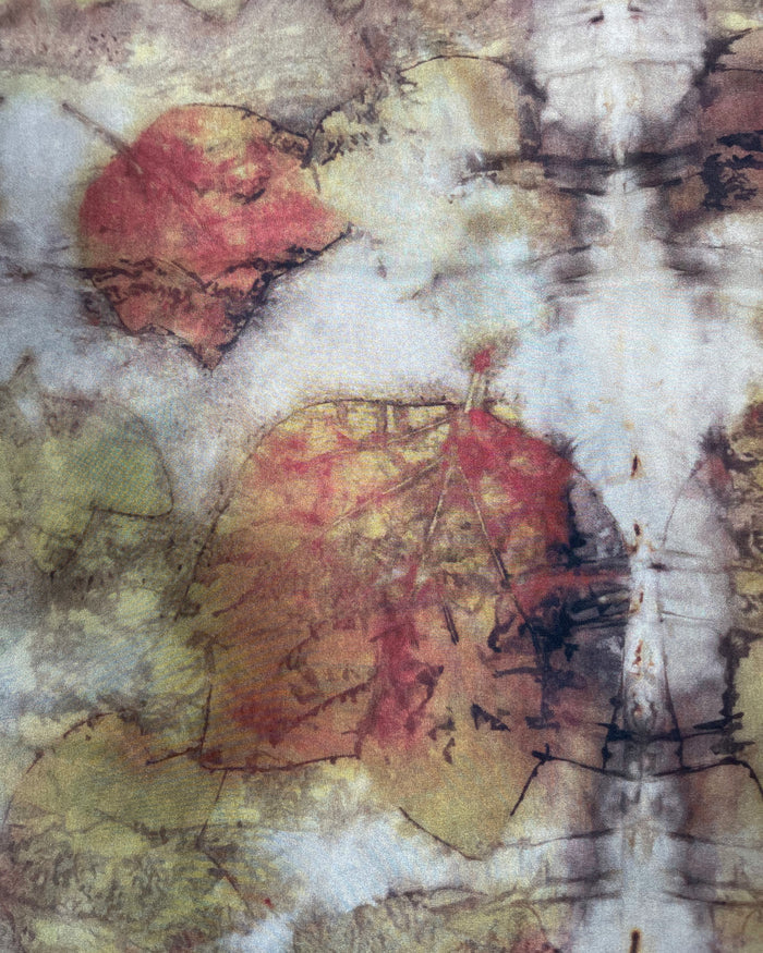 Abstract art with red and yellow leaves on a textured white background