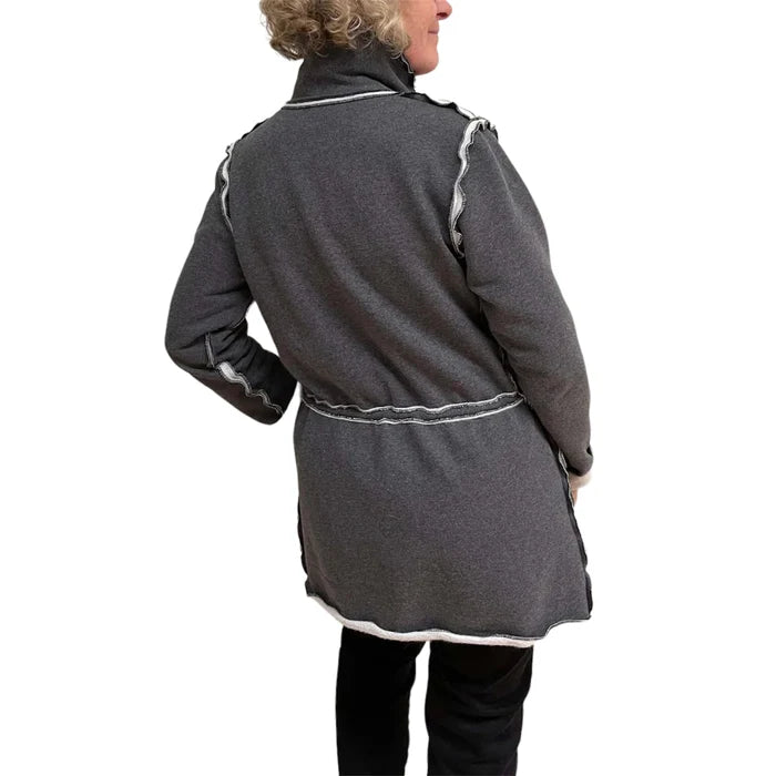 Person wearing a gray coat with white trim on a white background