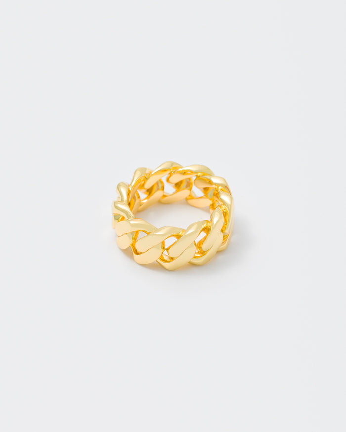 detail of gold cuban ring for man end woman