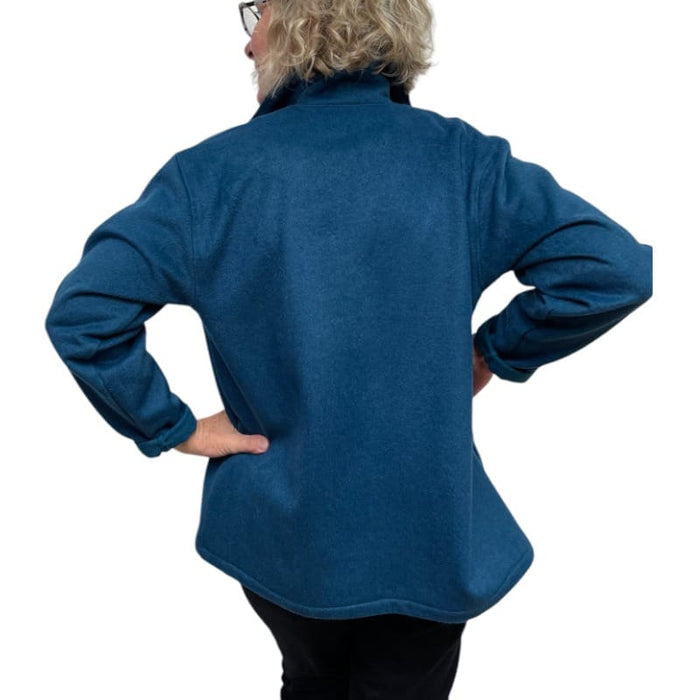 Person wearing a blue fleece jacket on a white background