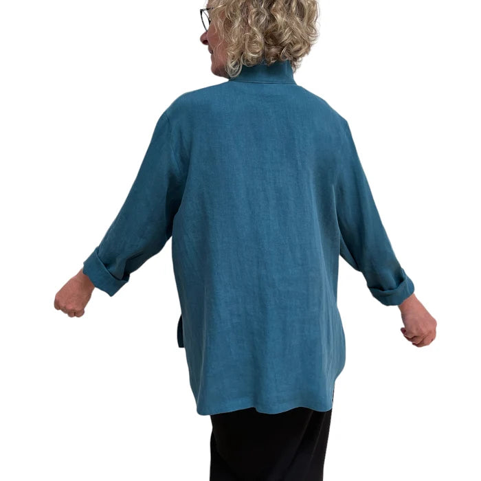 Person wearing a blue tunic on a white background