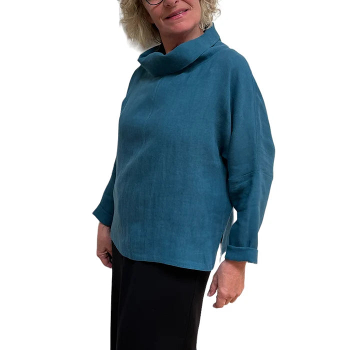 Person wearing a blue sweater on a white background