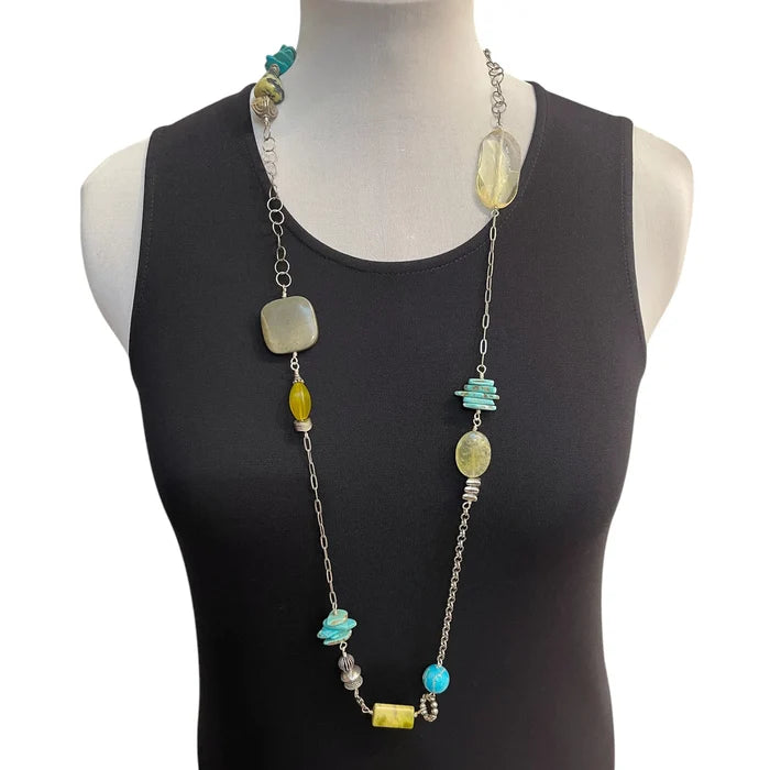 Necklace with beads on a mannequin wearing a black top