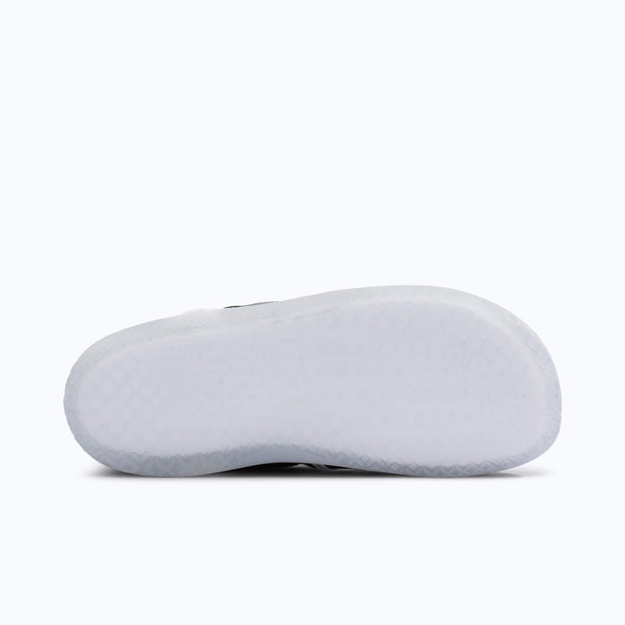Xero Shoes XT Max Women Shoe in Black with White Quick Laces Outsole Visible and with Toe Facing Right